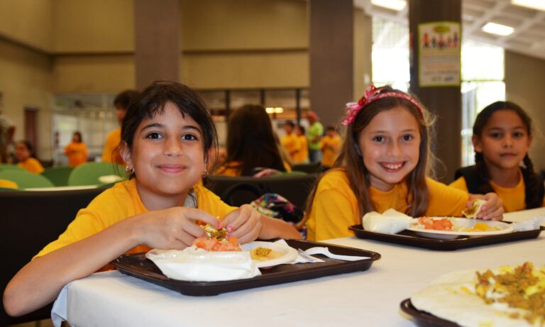 Kids enjoying Children’s Day meal at a restaurant in India